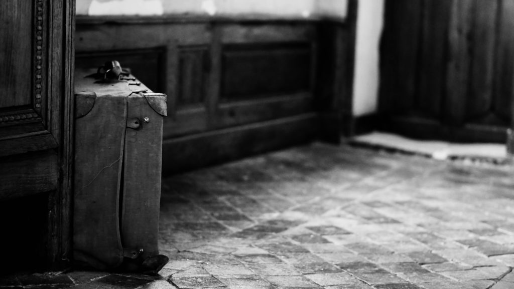 a suitcase sits on the ground